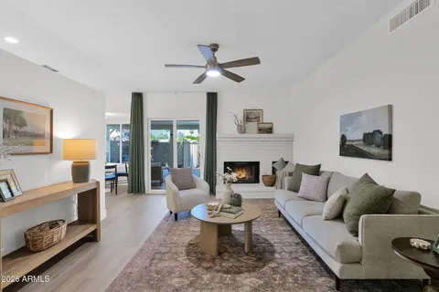 a living room with furniture and a fireplace