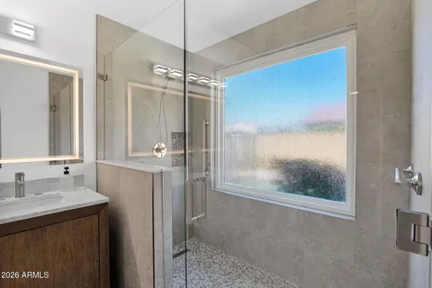 a bathroom with a sink and a mirror