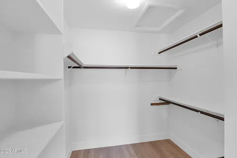 a bathroom with a shower sink and mirror