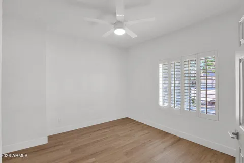 a view of a room with wooden floor