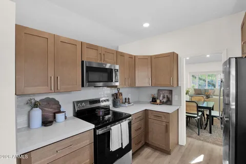 a kitchen with a sink stainless steel appliances and cabinets