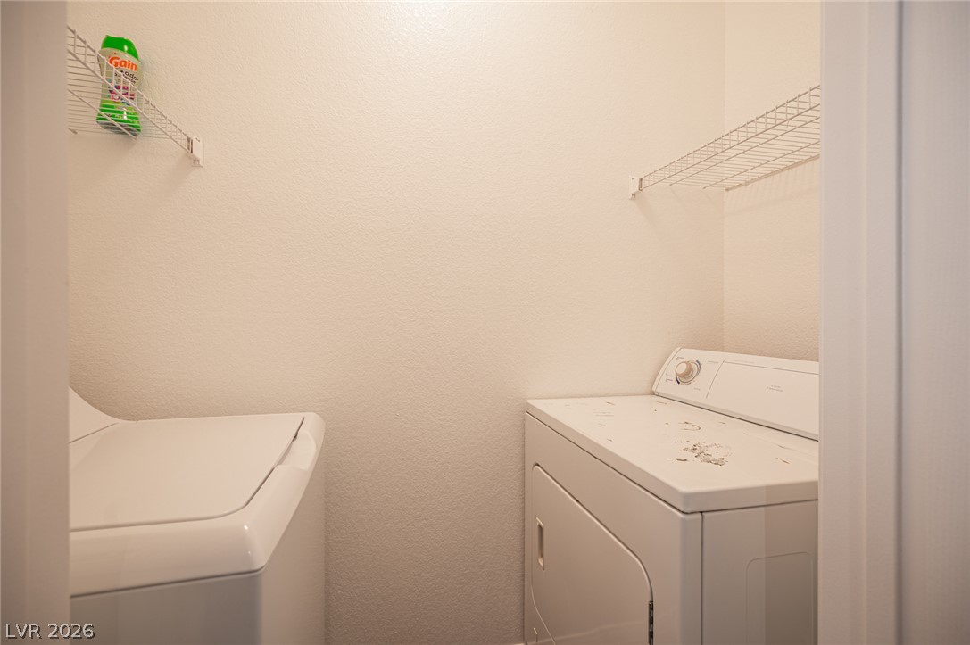 10550 West Alexander Road, Unit 2014 Las Vegas, NV 89129 - Photo 24 of 43 Functional laundry closet equipped with wire shelving over the appliances.