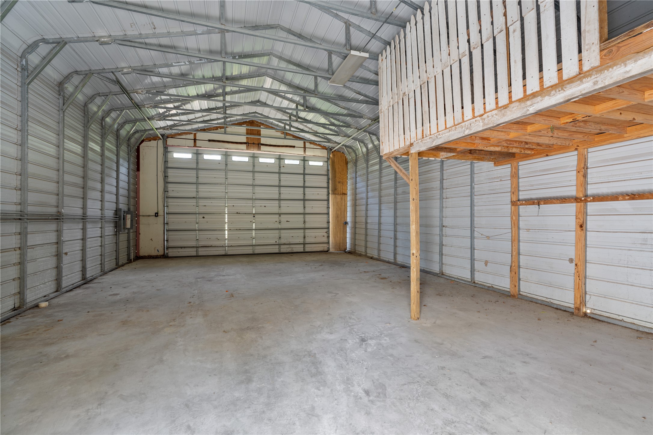 735 Laurelia Loop Corrigan, TX 75939 - Photo 34 of 48 Shop with Overhead Door and Storage Loft Area