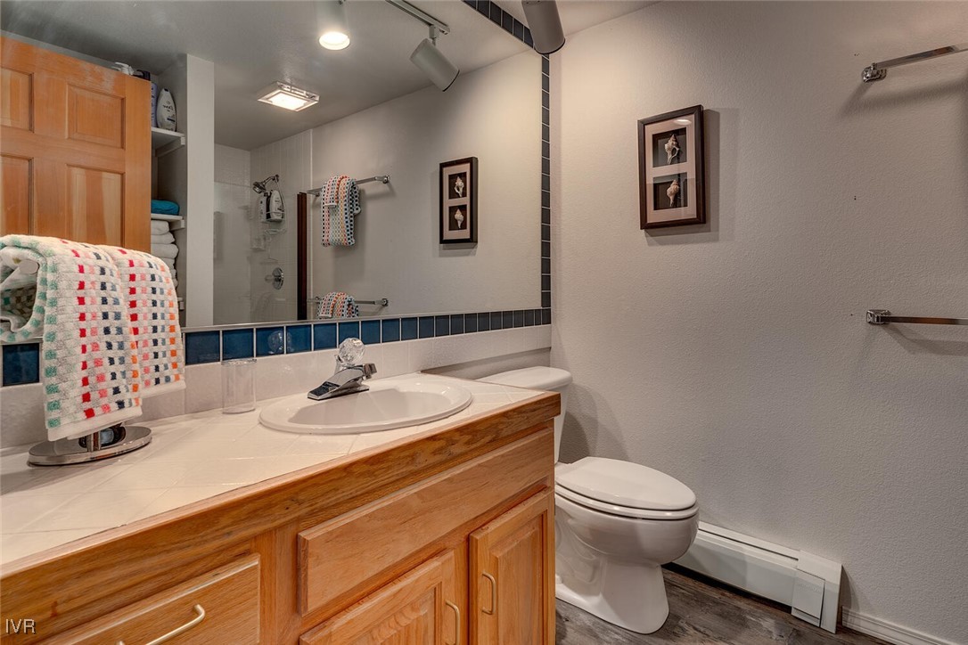931 Incline Way, Unit 249 Incline Village, NV 89451 - Photo 11 of 21 a bathroom with a sink toilet and mirror