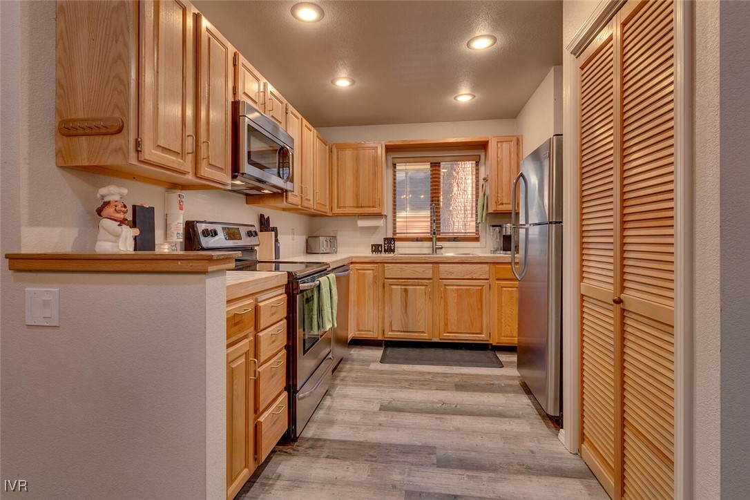 931 Incline Way, Unit 249 Incline Village, NV 89451 - Photo 15 of 21 a kitchen with stainless steel appliances granite countertop a sink and cabinets