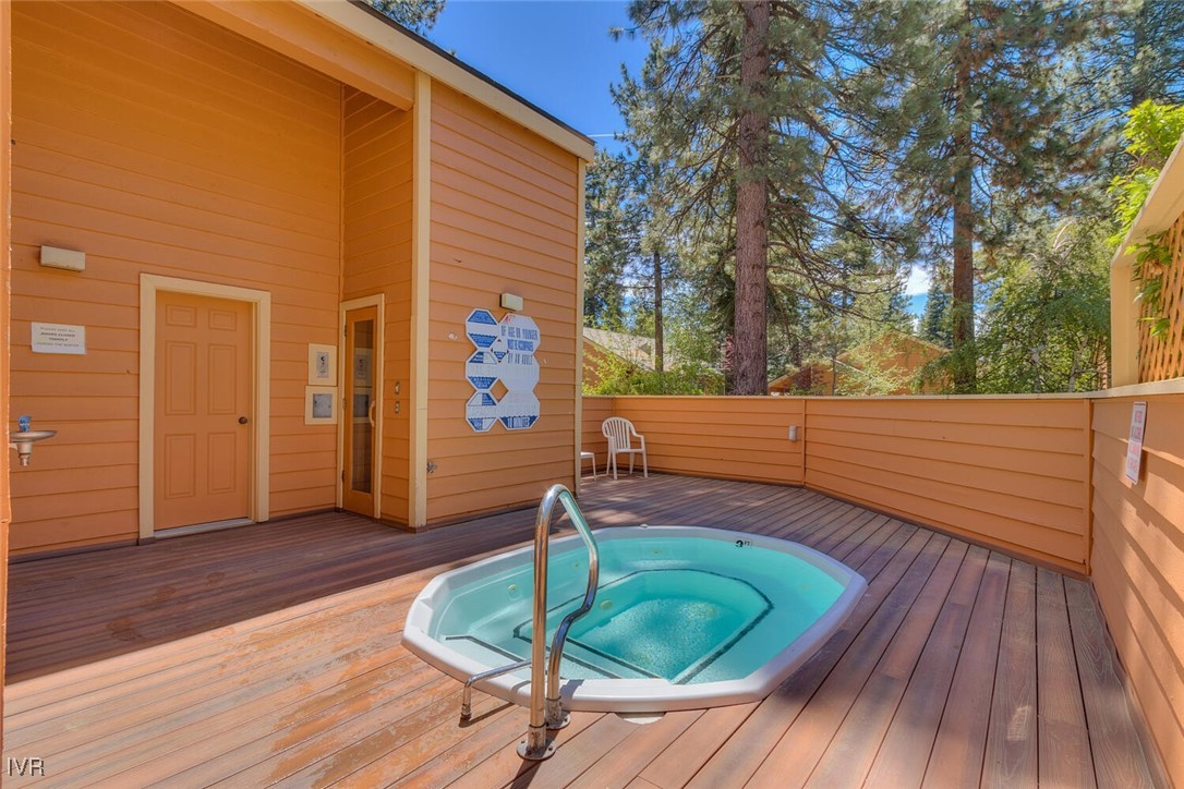 931 Incline Way, Unit 249 Incline Village, NV 89451 - Photo 17 of 21 a backyard of a house with wooden floor chairs and wooden floor
