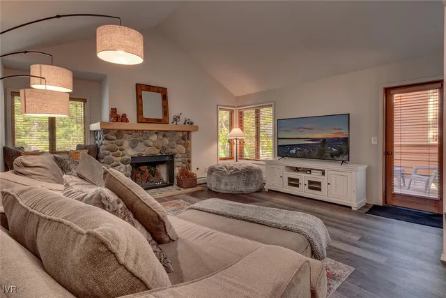 a living room with furniture and a fireplace