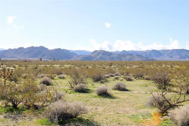 a view of a mountain with lake view