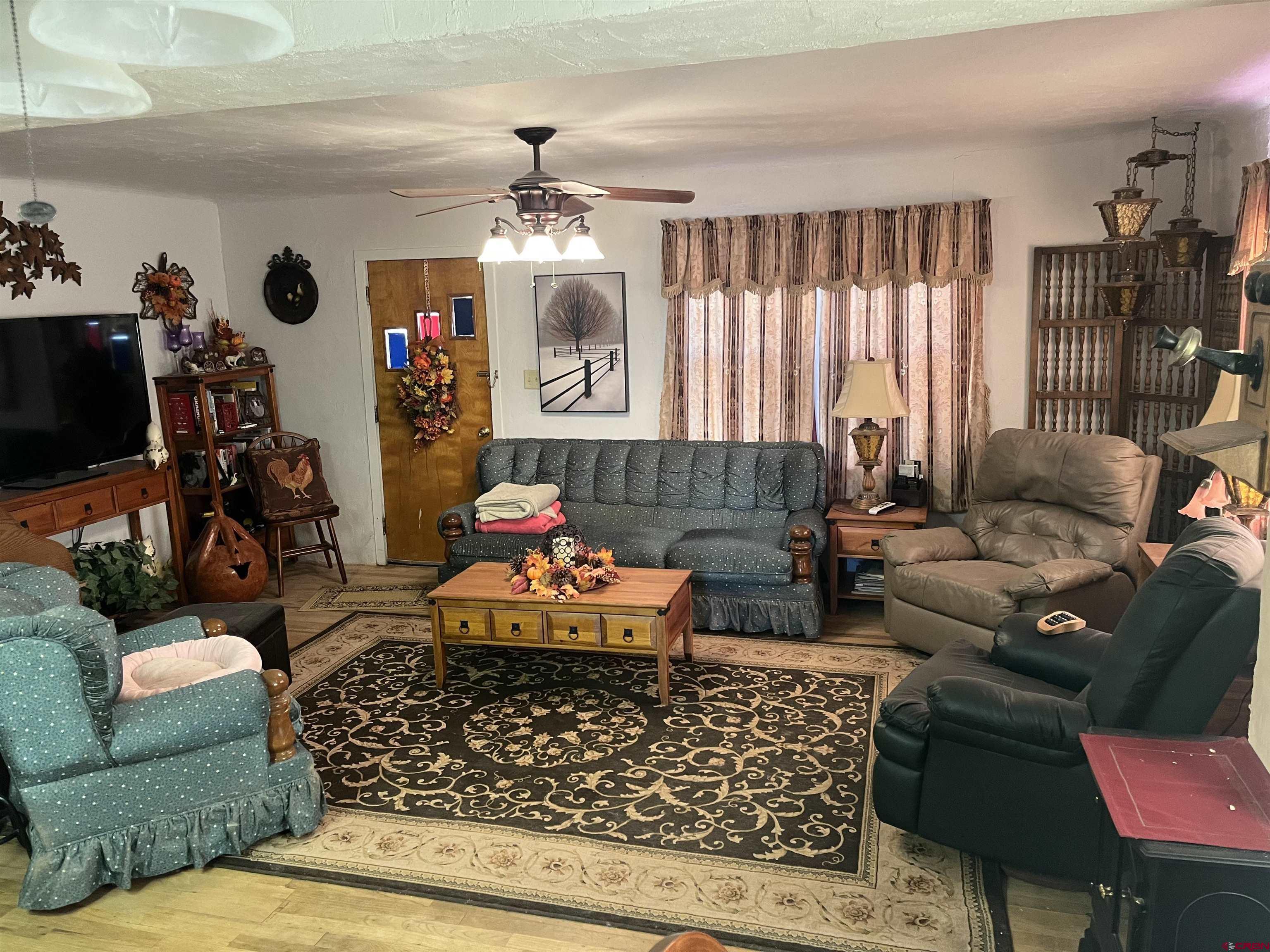 Tbd Tbd 17th Road Yellow Jacket, CO 81335 - Photo 12 of 17 a living room with furniture and a chandelier