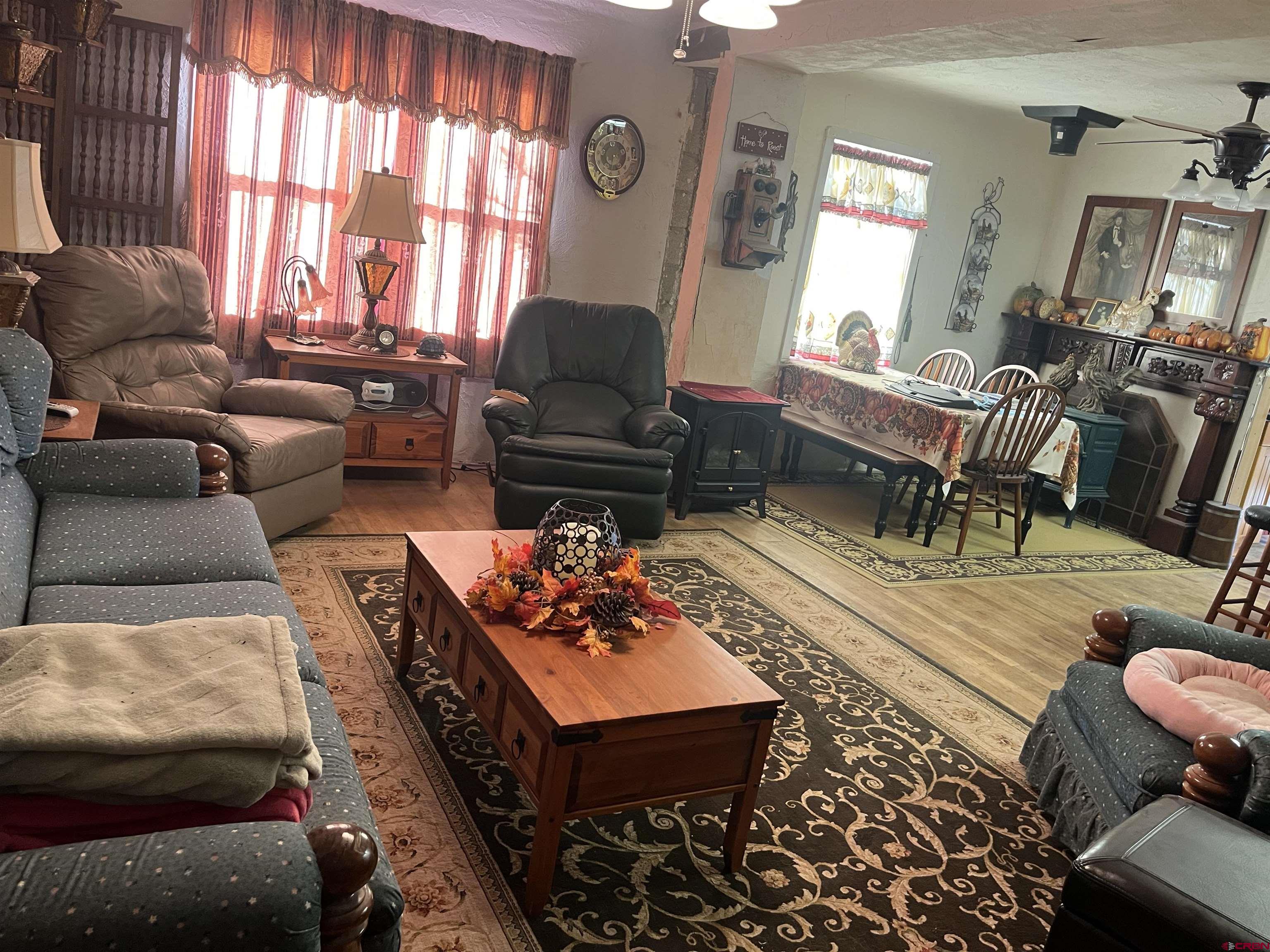 Tbd Tbd 17th Road Yellow Jacket, CO 81335 - Photo 15 of 17 a living room with furniture fireplace and a large window