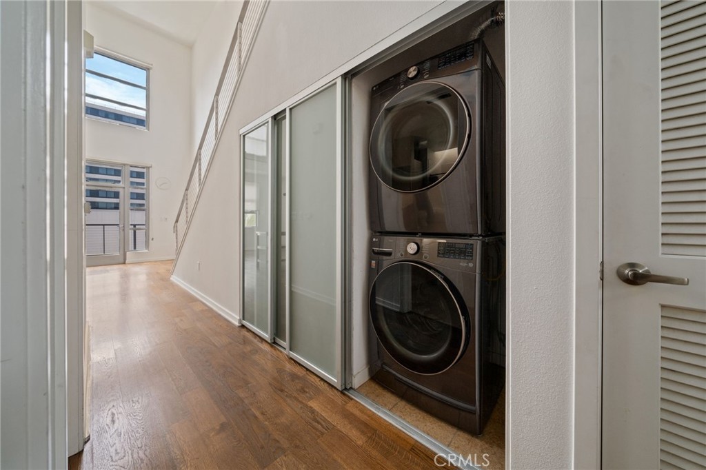 133 The, Unit 404 Long Beach, CA 90802 - Photo 6 of 27 a view of a hallway with washer and dryer