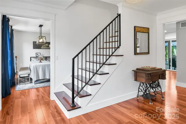 a view of entryway livingroom and hall with wooden floor