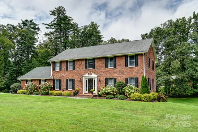 a front view of a house with a garden and porch