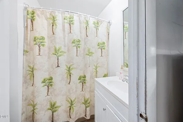 a white bath tub with a shower