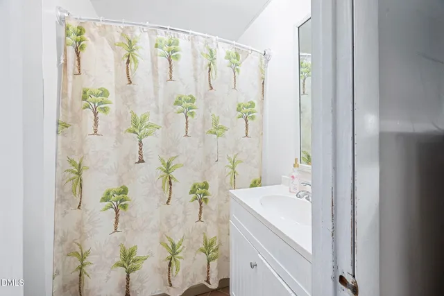 a white bath tub with a shower