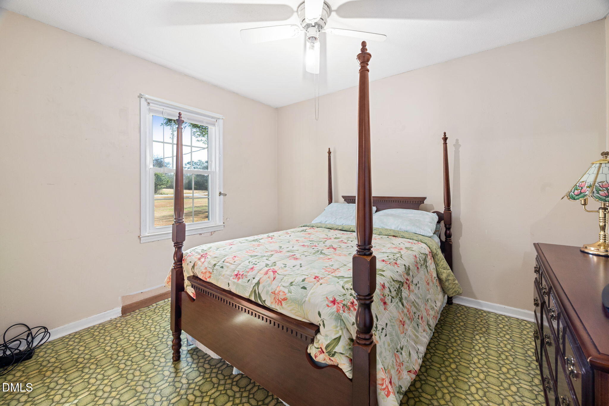 1804 Gade Bryant Road Moncure, NC 27559 - Photo 17 of 38 a bedroom with a bed and a window