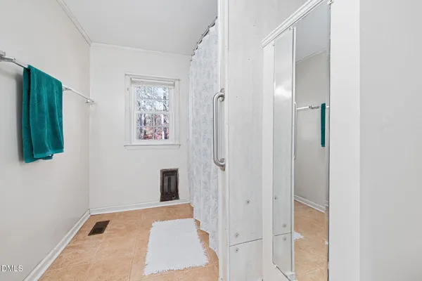 a view of a hallway with wooden floor and entryway