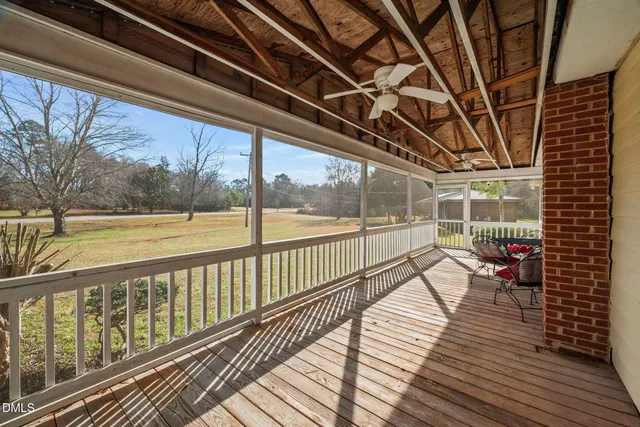 a view of balcony with wooden floor
