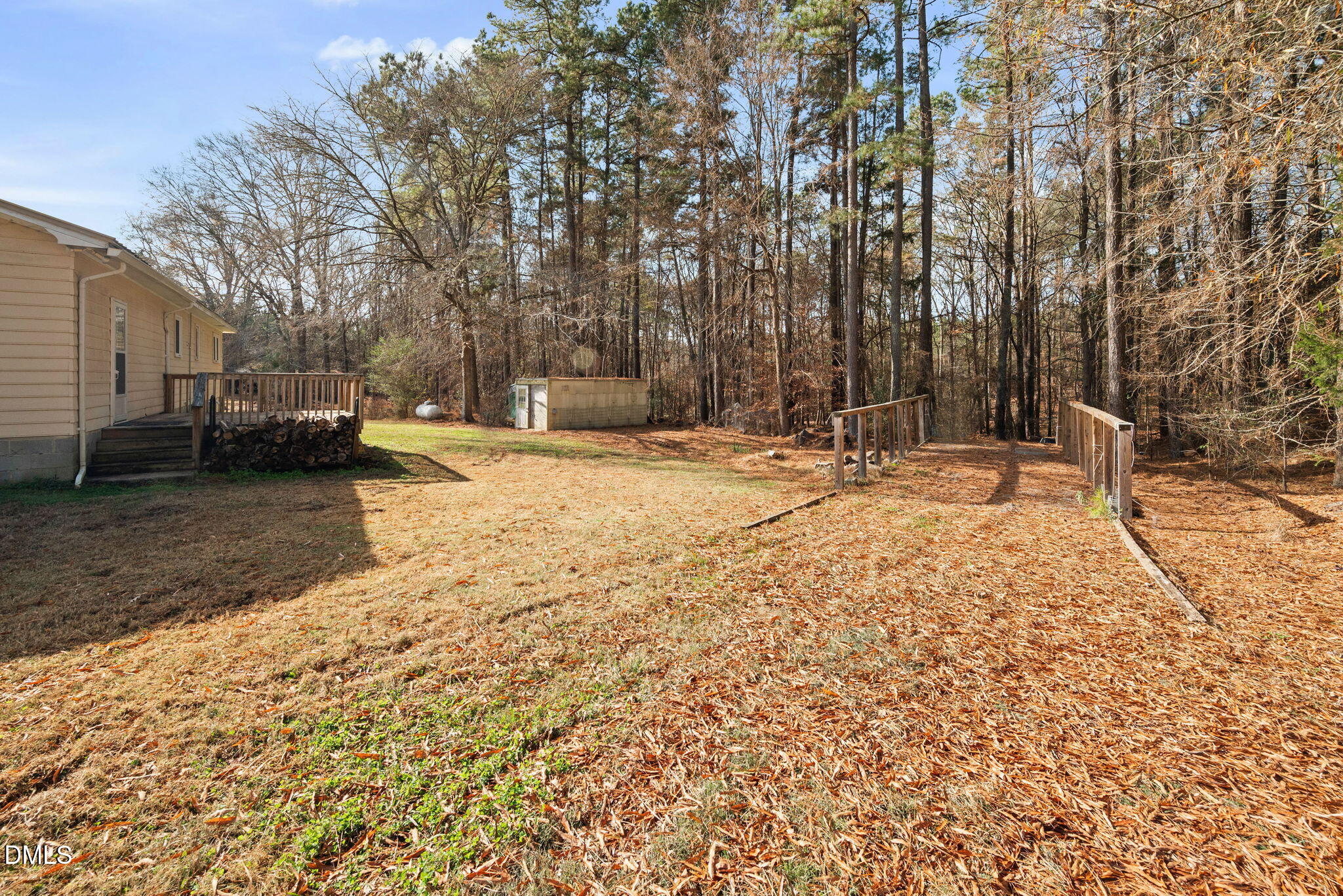 1804 Gade Bryant Road Moncure, NC 27559 - Photo 30 of 38 a backyard of apartments with large trees