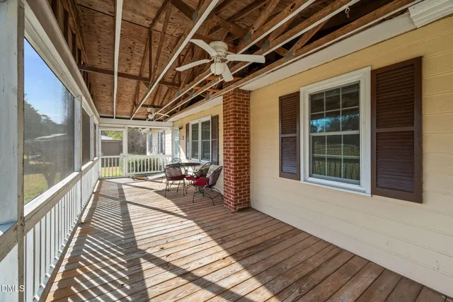 a view of a balcony with wooden floor