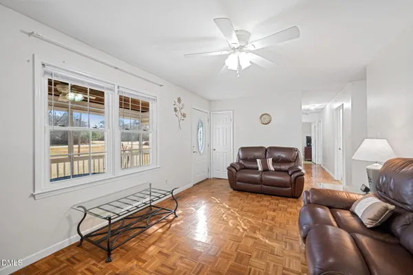 a living room with furniture and a window