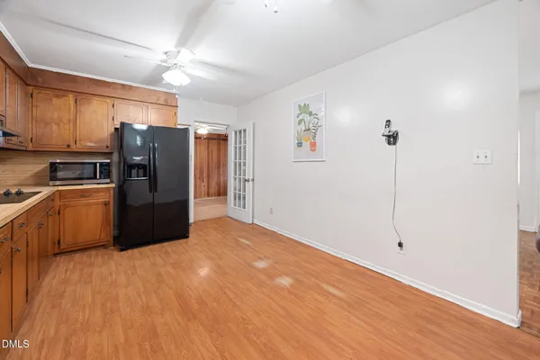 a kitchen with stainless steel appliances a refrigerator and a sink