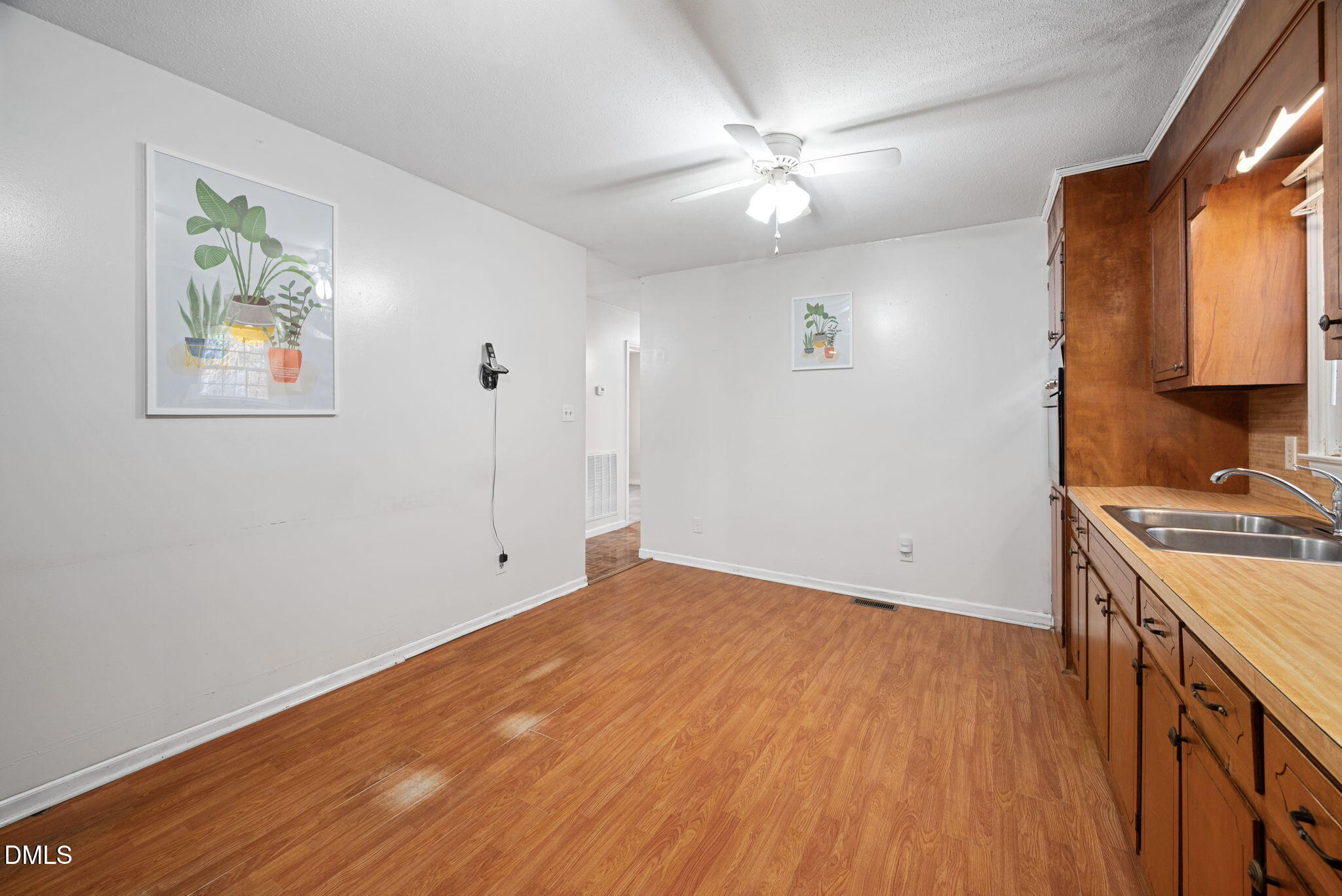 1804 Gade Bryant Road Moncure, NC 27559 - Photo 10 of 38 a view of a kitchen with a sink wooden floor and a window