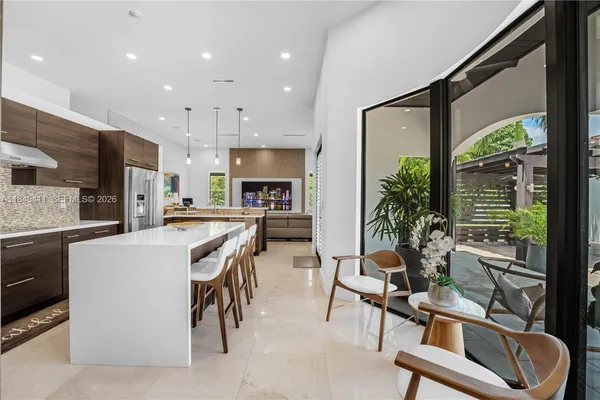 a bedroom with furniture and a window