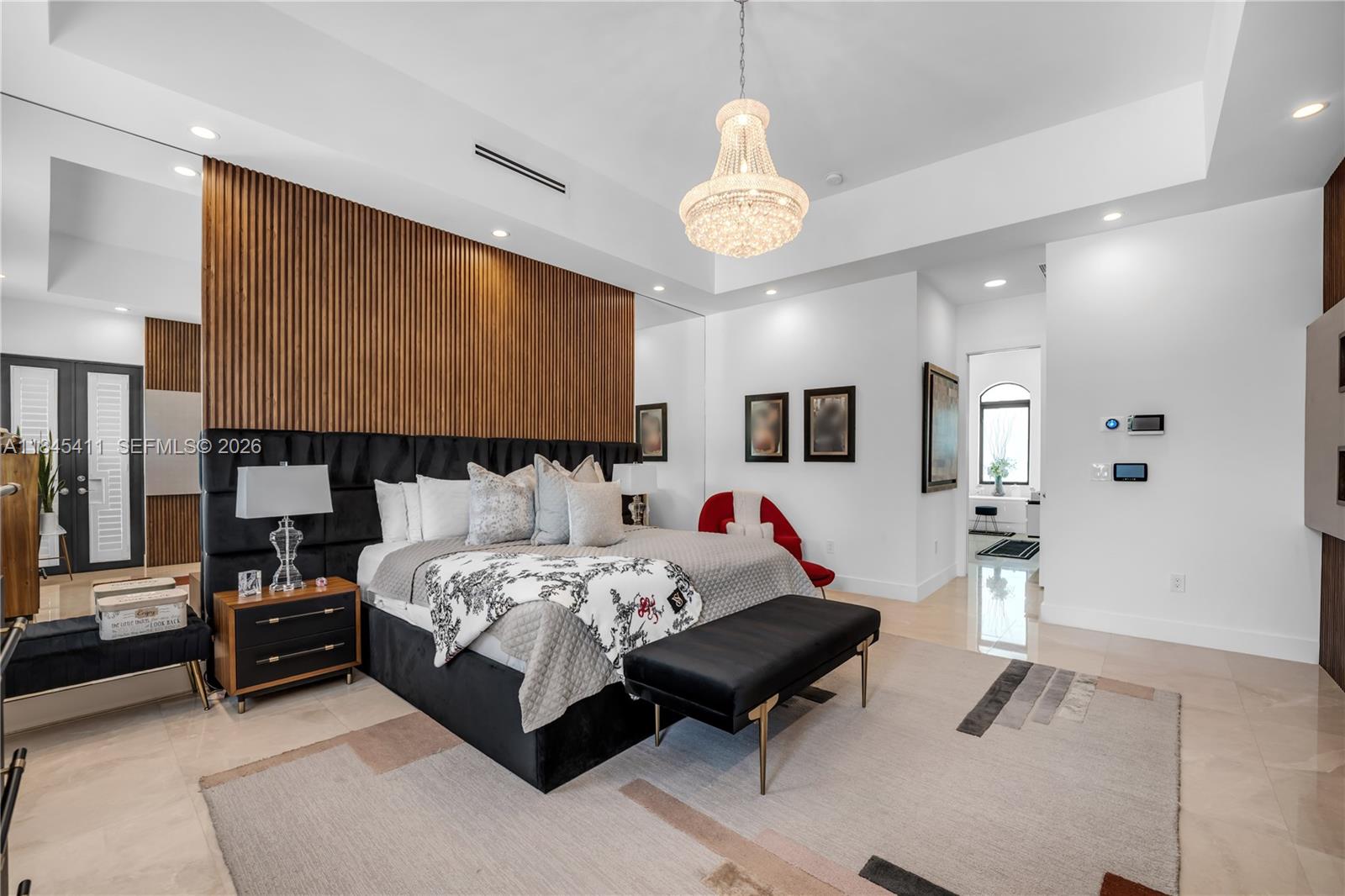 331 Southwest 124th Avenue Miami, FL 33184 - Photo 19 of 69 a spacious bedroom with a bed and a chandelier