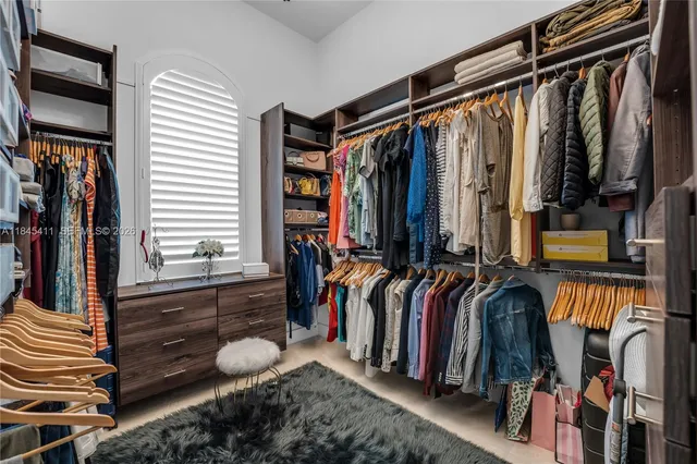 a view of a swimming pool with a lounge chair