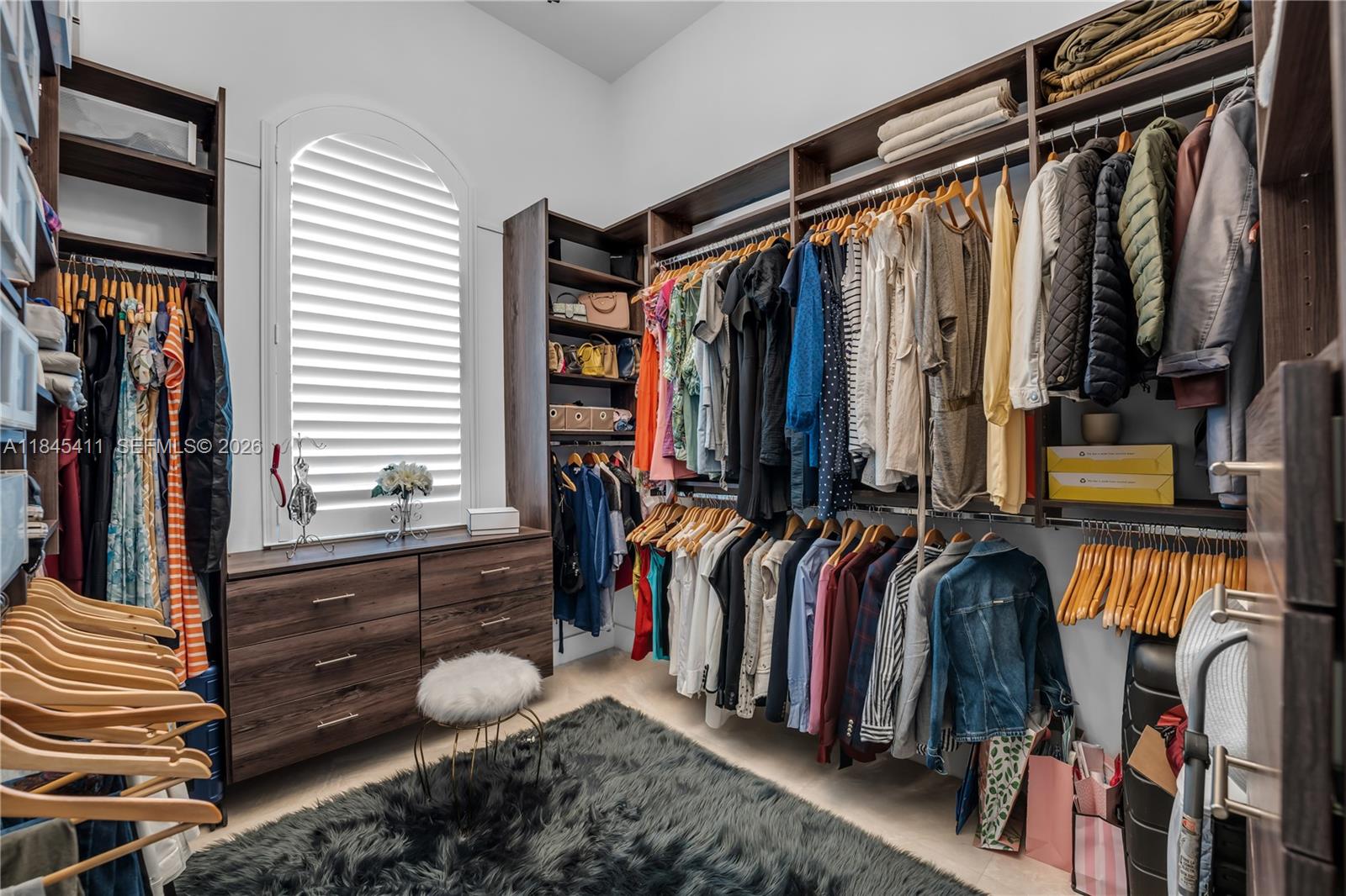 331 Southwest 124th Avenue Miami, FL 33184 - Photo 20 of 69 a view of walk in closet with clothes and shoes