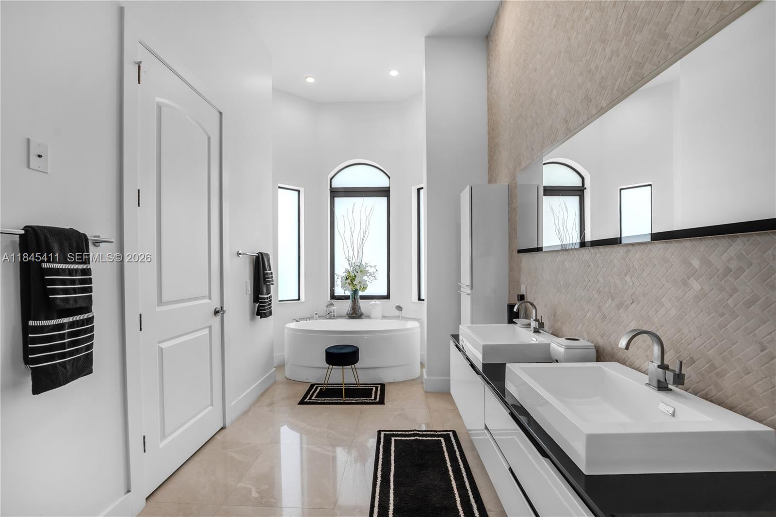 331 Southwest 124th Avenue Miami, FL 33184 - Photo 21 of 69 a spacious bathroom with a sink a mirror and a shower