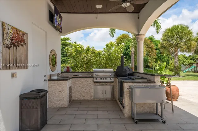 an aerial view of residential houses with outdoor space and trees