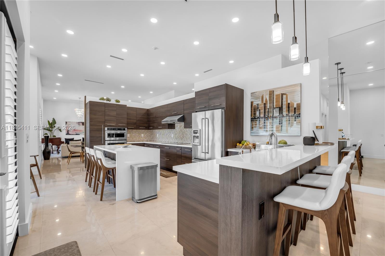 331 Southwest 124th Avenue Miami, FL 33184 - Photo 4 of 69 a large kitchen with a table and chairs in it