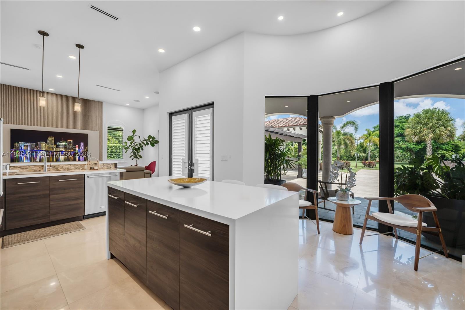 331 Southwest 124th Avenue Miami, FL 33184 - Photo 8 of 69 a kitchen with kitchen island a large window in it