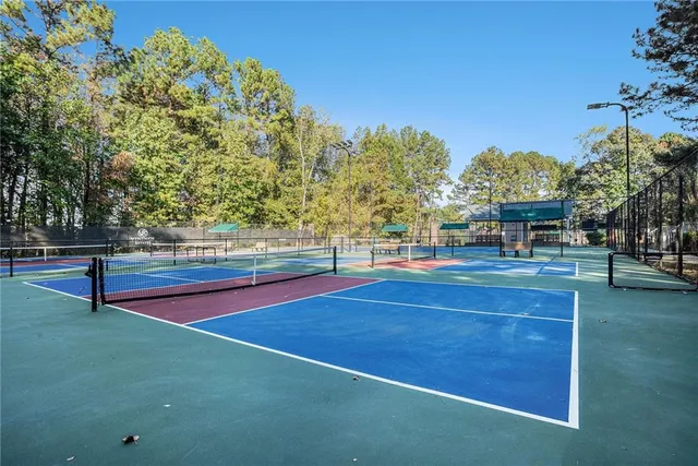 a swimming pool with outdoor seating and yard
