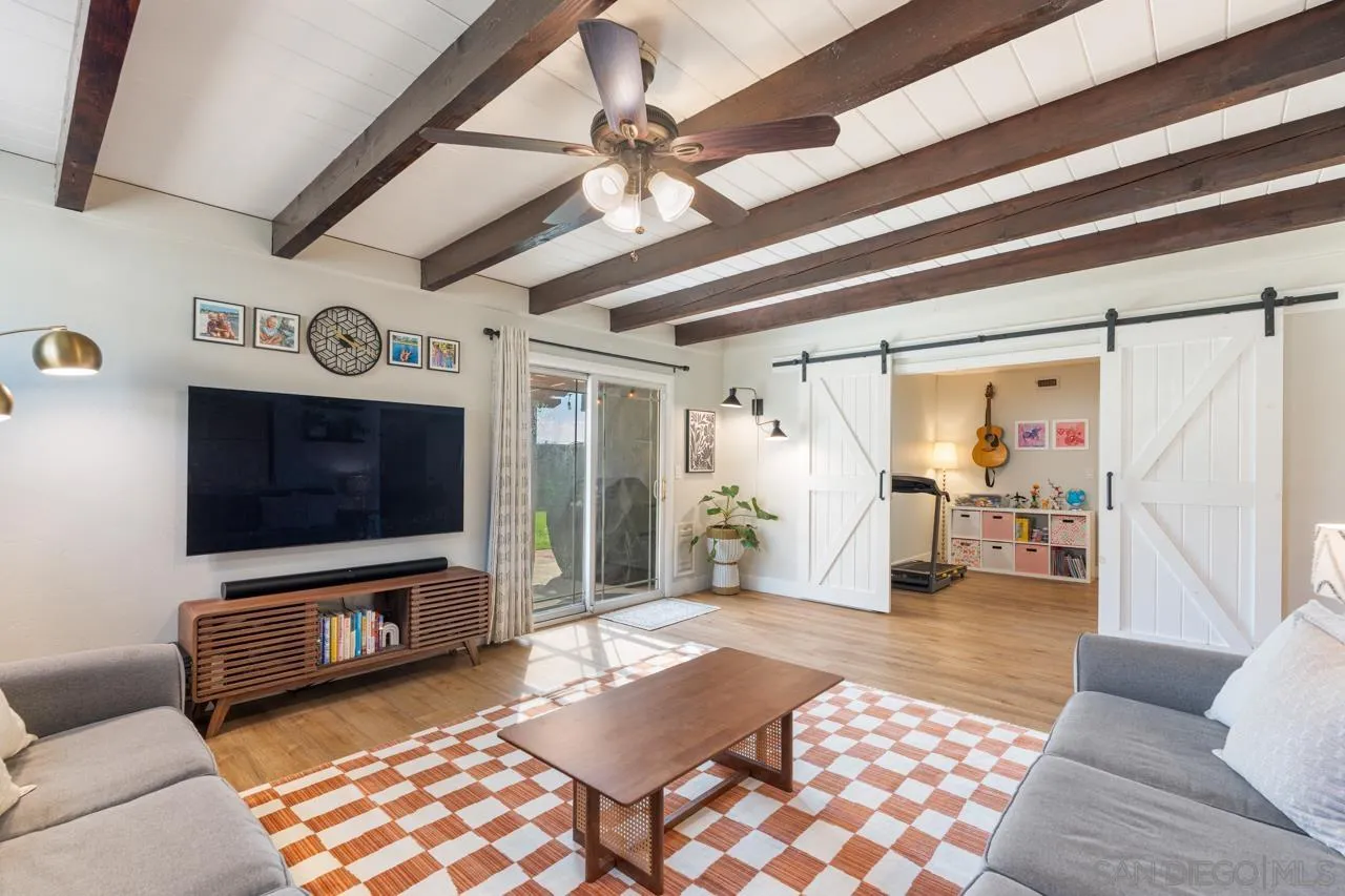 10113 Gem Tree Way Santee, CA 92071 - Photo 11 of 49 a living room with furniture and a flat screen tv