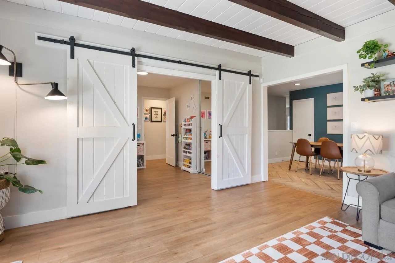 10113 Gem Tree Way Santee, CA 92071 - Photo 13 of 49 a view of a hallway with wooden floor and furniture