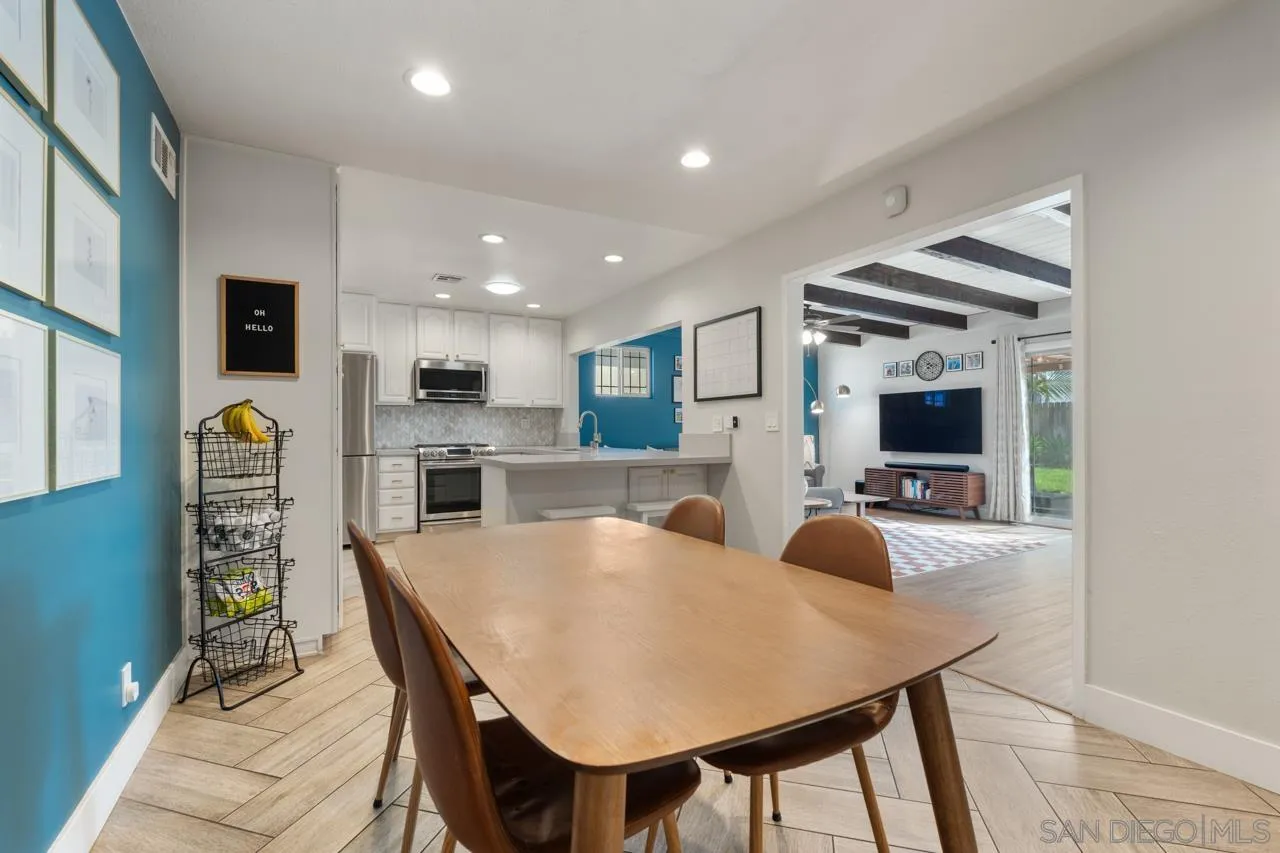 10113 Gem Tree Way Santee, CA 92071 - Photo 15 of 49 a large kitchen with a table and chairs in it