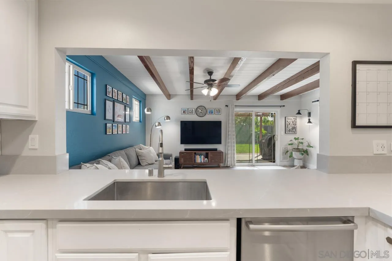 10113 Gem Tree Way Santee, CA 92071 - Photo 22 of 49 a kitchen with a sink and a refrigerator