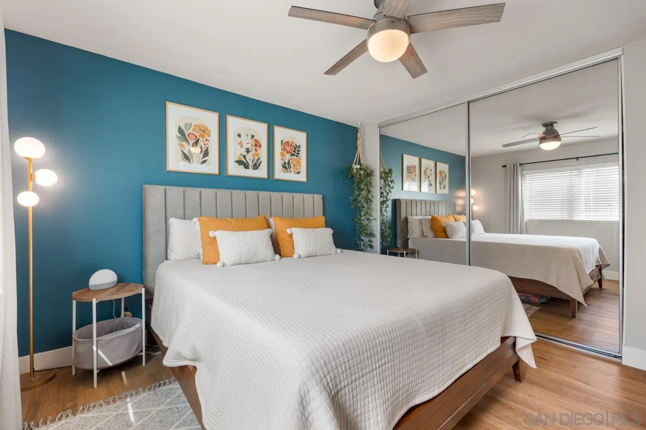 10113 Gem Tree Way Santee, CA 92071 - Photo 24 of 49 a bedroom with a bed and a chandelier