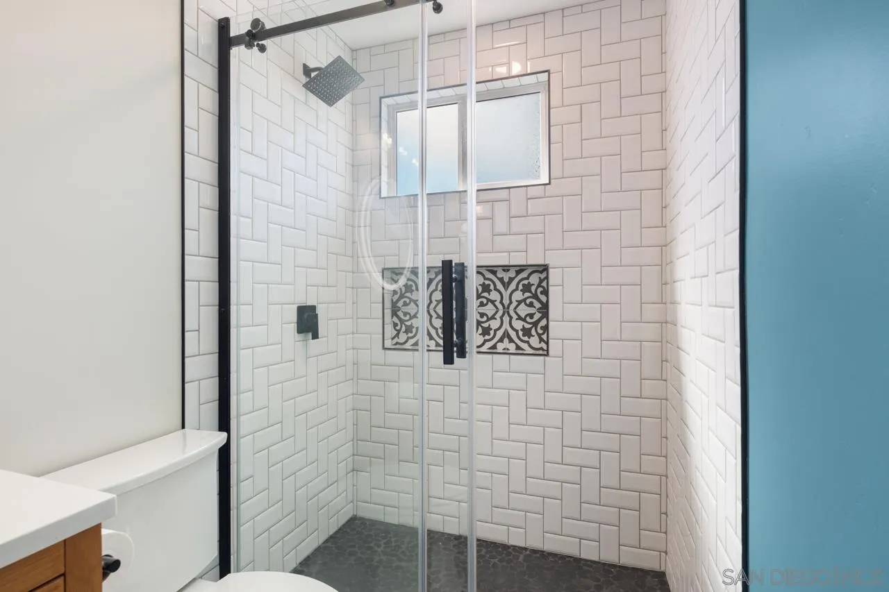 10113 Gem Tree Way Santee, CA 92071 - Photo 27 of 49 a bathroom with a shower and a sink