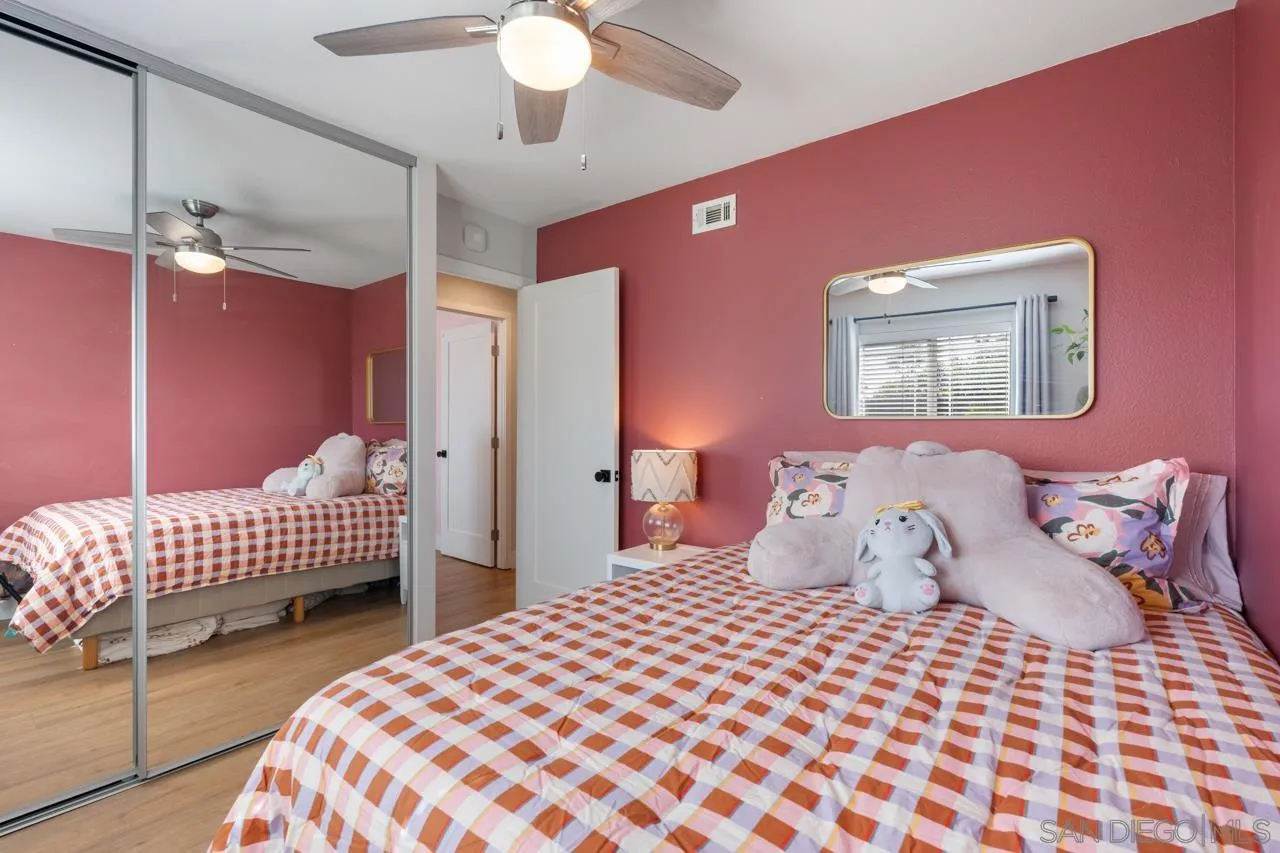 10113 Gem Tree Way Santee, CA 92071 - Photo 29 of 49 a bedroom with a bed and lamp