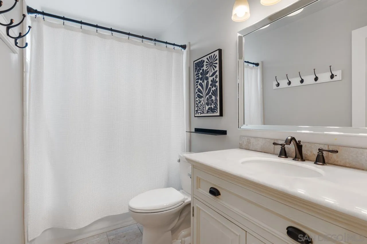 10113 Gem Tree Way Santee, CA 92071 - Photo 31 of 49 a bathroom with a sink and a mirror