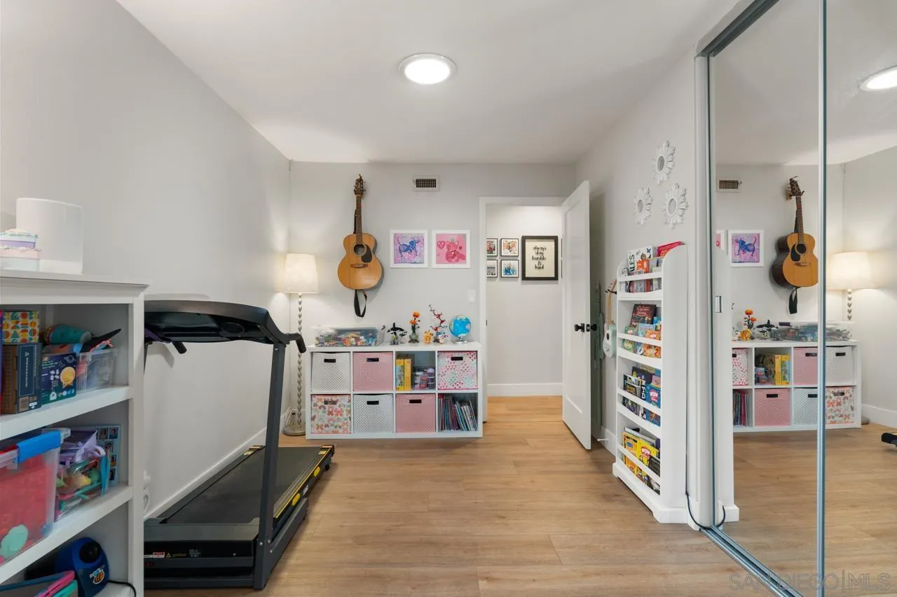 10113 Gem Tree Way Santee, CA 92071 - Photo 33 of 49 a room with furniture and a book shelf