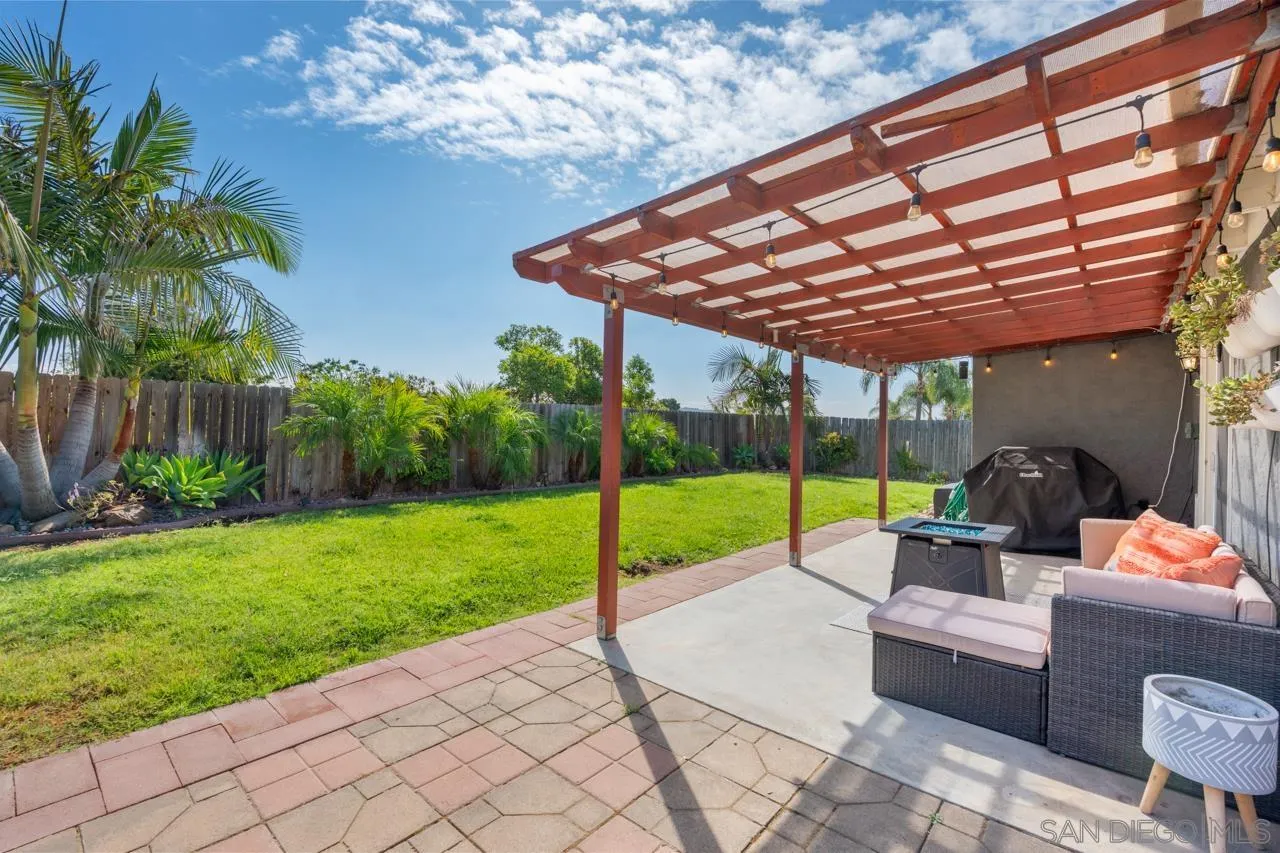 10113 Gem Tree Way Santee, CA 92071 - Photo 36 of 49 a house view with a sitting space and garden view