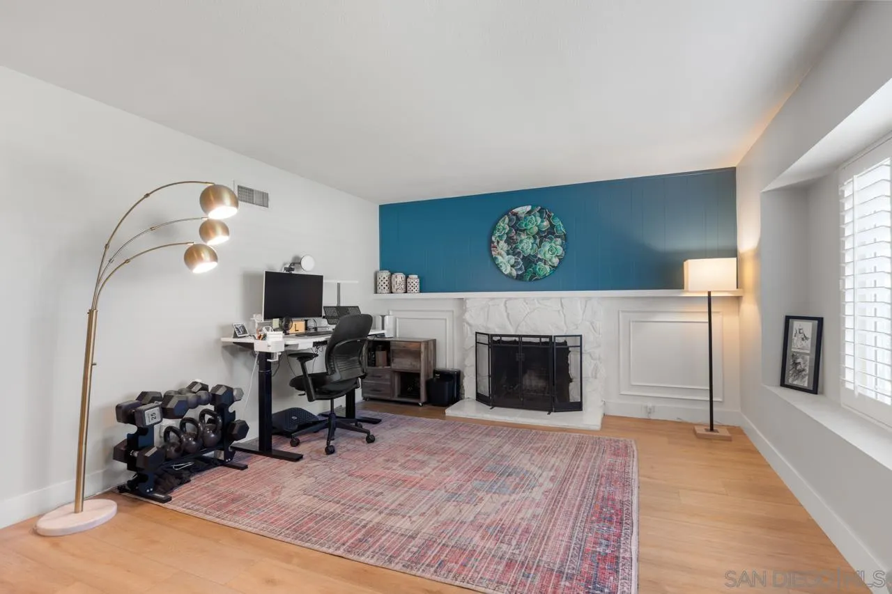 10113 Gem Tree Way Santee, CA 92071 - Photo 5 of 49 a view of a livingroom with furniture and a fireplace
