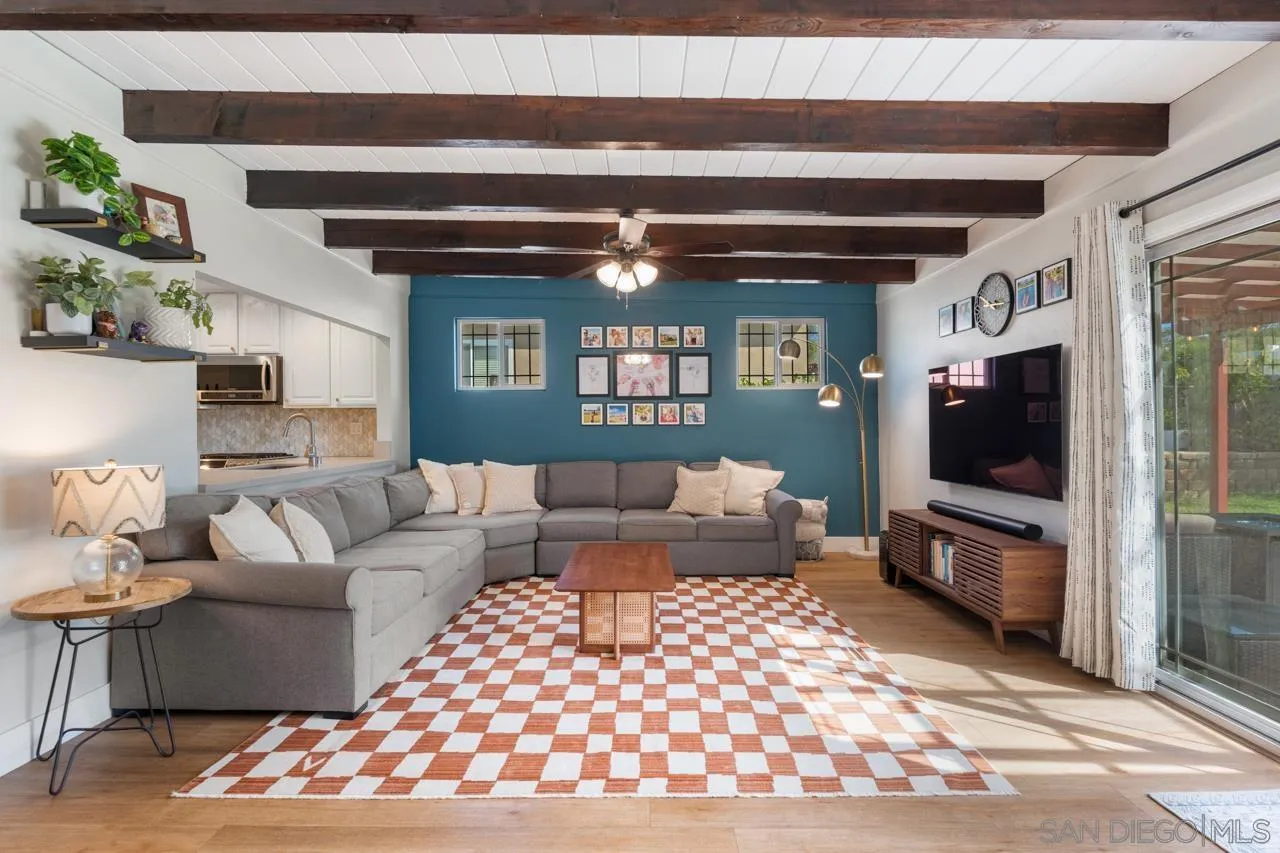 10113 Gem Tree Way Santee, CA 92071 - Photo 7 of 49 a living room with furniture and a flat screen tv