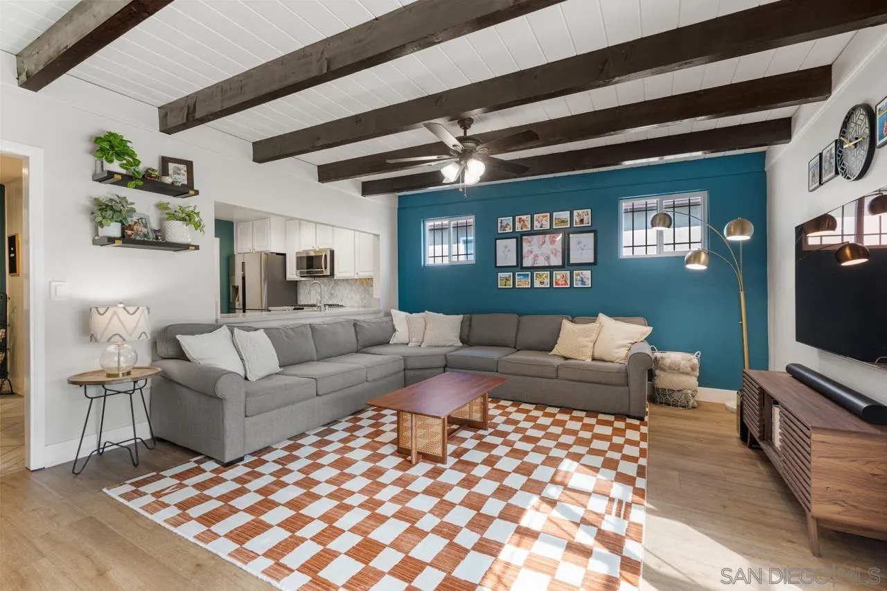 10113 Gem Tree Way Santee, CA 92071 - Photo 9 of 49 a living room with furniture a flat screen tv and a fireplace