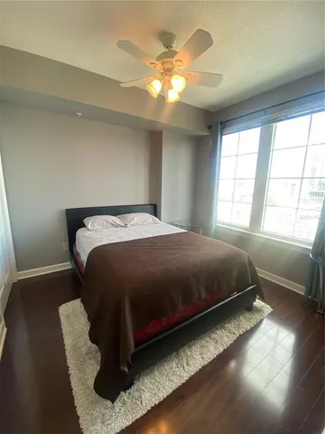 a bedroom with a bed and window